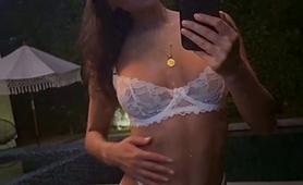 Slender Brunette Posing In Sexy White Lingerie Outside